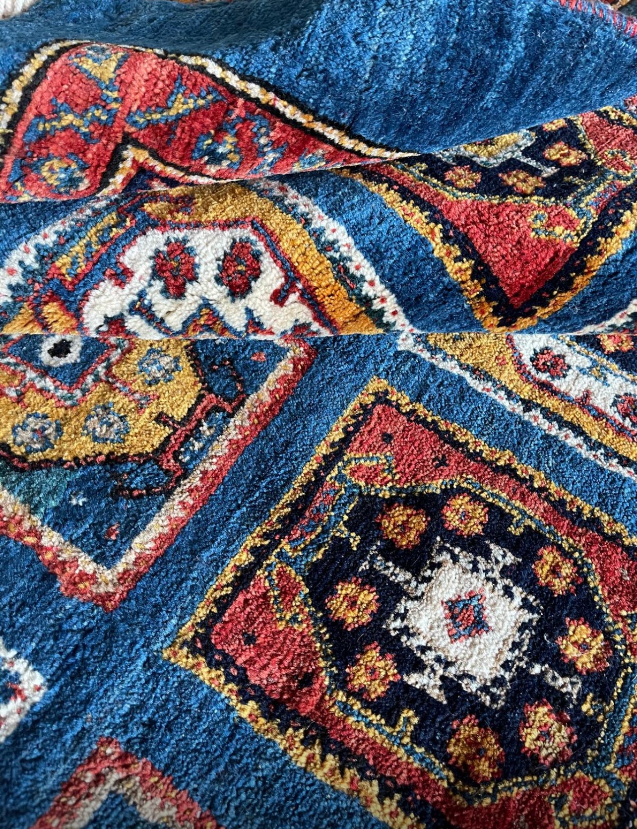 Authentic Qashqai Rug Handwoven with Handspun Wool 

This authentic Qashqai Gabbeh rug is handcrafted using traditional techniques passed down through generations. The wool used in this rug is entirely handspun, meaning it is not processed by industri